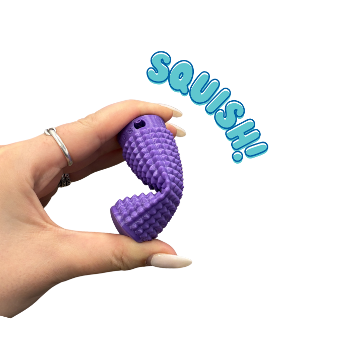 Little Ouchies Grippie Ergo Squish, the soft bendable fidget in the Back to School Bundle, shown folding between two fingers