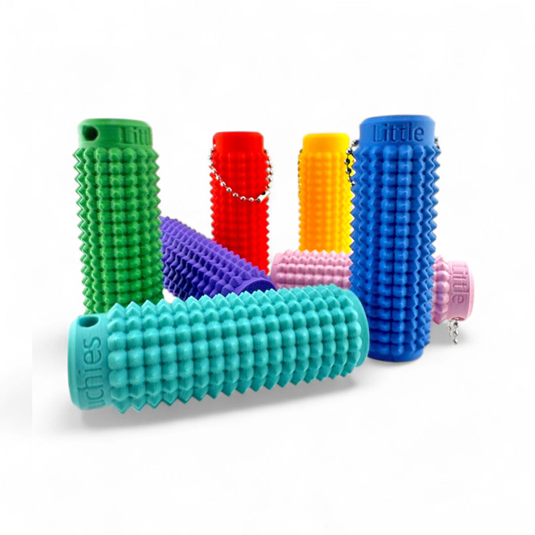 Little Ouchies Grippies shown in all colors, Little Ouchies Grippies are designed for pain stims, Little Ouchies Grippies for anxiety and stress, Little Ouchies for sensory regulation, Little Ouchies for self-soothing, pain stim toys for kids, autism fidgets for adults, discrete fidget toys, pain stim fidget, pain stim toys, fidget, fidget toys, anxiety tools, stress relief toys, pain fidget
