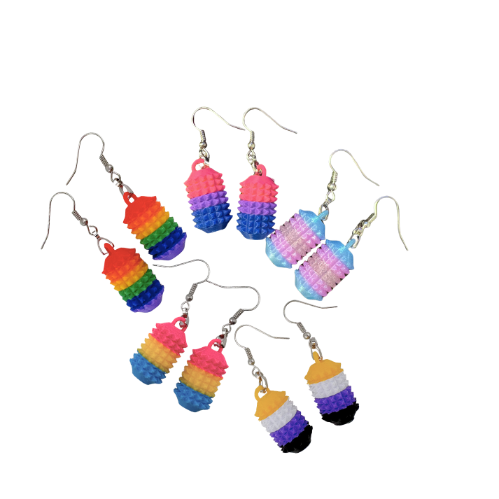 Little Ouchies Grippie Earrings, Little Ouchies Grippie Earrings designed for pain stims, Little Ouchies Grippie Earrings for anxiety and stress, Little Ouchies for sensory regulation, Little Ouchies for self-soothing, pain stim,, autism fidgets for adults, discrete fidget toys, small fidgets, wearable fidget, wearable fidget for adults, Pride earrings, Pride sensory earrings, pride sensory tools, pride fidgets, 
